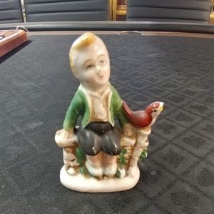 Boy sitting with Bird Figurine, Occupied Japan